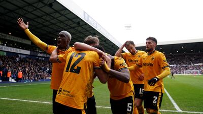 Wolves celebrate the second goal on Sunday, after which crowd trouble broke out. PA