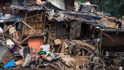 Officials destroy houses in the eviction area of the Bukit Duri neighbourhood, on the Ciliwung river banks in Jakarta, Indonesia. Authorities ordered residents to vacate their settlements, which have built on the riverbanks, and relocate to new flats, as the government attempts to clear the flood-prone areas where more than a thousand homes were demolished two years ago. AFP Photo / Bay Ismoyo