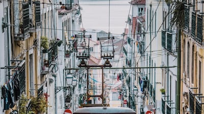 Lisbon's cheery yellow trams. Courtesy Getty
