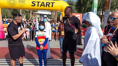 Usain Bolt with Emirati para athlete Hamda Hosani at Expo 2020 Dubai.