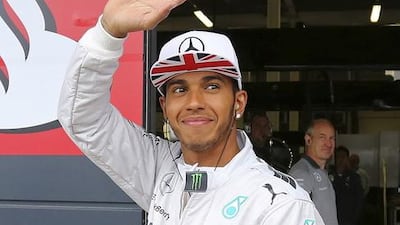 Mercedes Formula One driver Lewis Hamilton of Britain waves to fans during final practice ahead of the British Grand Prix at the Silverstone Race Circuit, central England, July 5, 2014. REUTERS/Paul Hackett