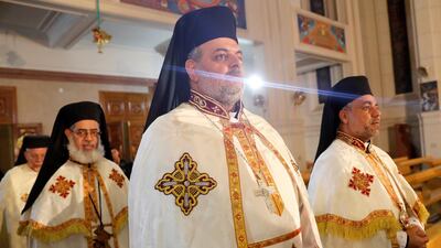 Egyptian Catholic priests perform a Christmas Eve service at the Virgin Mary Cathedral in Nasr City, a suburb of Cairo, Egypt. Reuters