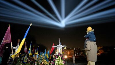 Illuminations over the graves of Ukrainian soldiers who died in the war with Russia at Lychakiv Cemetery in Lviv, on the eve of the first anniversary of the invasion. AFP
