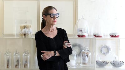 The British artist Patricia Millns in her Dubai studio with some of her minimalist sculptures, largely in whites and greys. Satish Kumar / The National