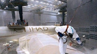 An Airbus A330 is painted for Etihad Airways in Toulouse in 2009. The national carrier has placed orders for two more of the planes. Gilles Bouquillon for The National