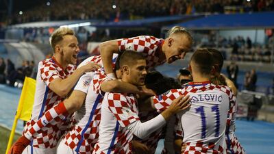 Croatia players celebrate during their 4-1 World Cup play-off win against Greece in Zagreb. Srdjan Stevanovic / Getty Images