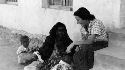 One of the two doctors at the opening of the Al Ain Oasis Hospital in 1960, Dr Marian Kenned speaks to a patient at the hospital’s first building, a mud block two-storey house donated by Sheikh Zayed. Courtesy Oasis Hospital