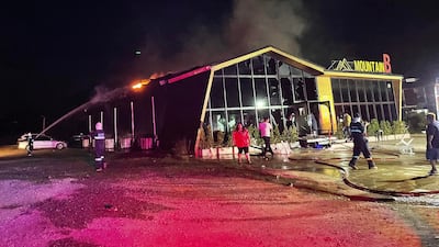Firefighters work to contain the fire at the Mountain B nightclub in Sattahip district, Thailand. AFP