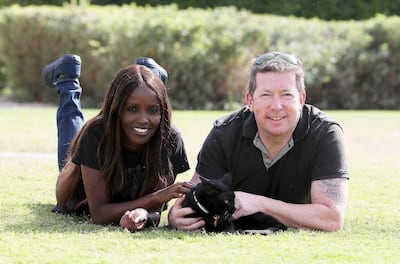 Jon Edwards and his wife Shiro Edwards with their cat Smudge. Pawan Singh / The National