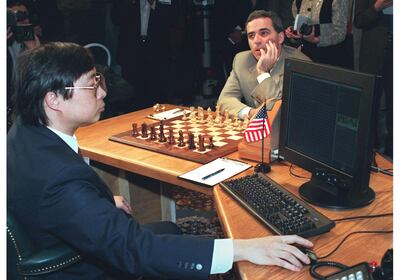 World Chess Champion Garry Kasparov, right, prepares to make his first move in a game against the IBM Deep Blue computer in 1997, in New York. AFP