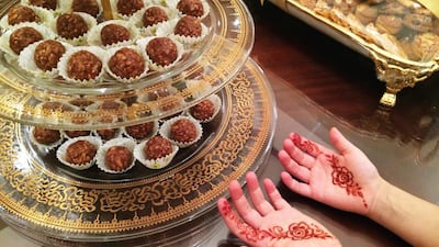 Day 29- 'All set for Eid and preparation is going on for the first day; preparing sweets and also kids designing there hands with Henna. Ammar Al Attar for the National