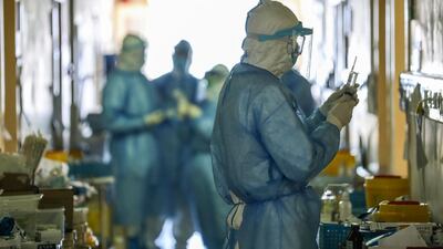 Medical staff members working at the isolation ward of the Wuhan Red Cross Hospital in Wuhan in China's central Hubei province. STR / AFP