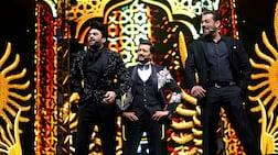 From left, Maniesh Paul, Riteish Deshmukh and Salman Khan host the IIFA Awards 2022 ceremony at Etihad Arena in Abu Dhabi. Photo: IIFA