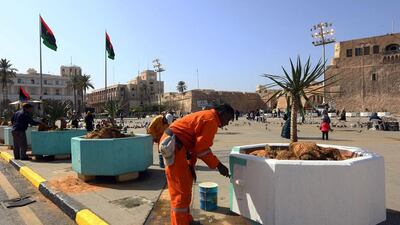 Libyan workers paint giant pots in Tripoli’s Martyrs’ Square on February 15, 2017 in preparation for celebrations marking the sixth anniversary of the start of the armed revolt that ousted longtime dictator Muammar Qaddafi with the country still mired in chaos and insecurity. Mahmud Turkia/AFP