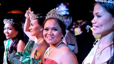 Norma Sanita, in the centre wearing a red dress, from Tacloban City in the Philippines, won the Miss KKB Dubai 2013 contest. Charles Crowell for The National