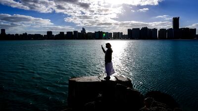 Clouds in a blue sky along the Corniche in central Abu Dhabi on a Sunday morning. Victor Besa / The National