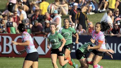 Dubai Sports City Eagles, in green, beat Emirates Firebirds 29-0 in the Gulf Women's final at the Dubai Rugby Sevens. Satish Kumar for The National