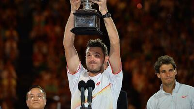 Stan Wawrinka lifts his trophy after winning the 2014 Australian Open in January. Saeed Khan / AFP / January 26, 2014