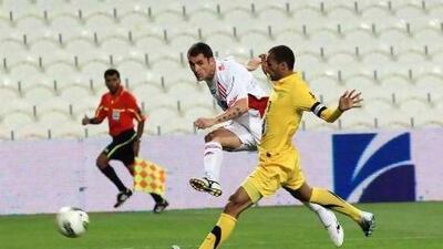 Al Jazira, in white, beat Al Wasl despite some key players missing from the pitch in Abu Dhabi last night. Ravindranath K / The National