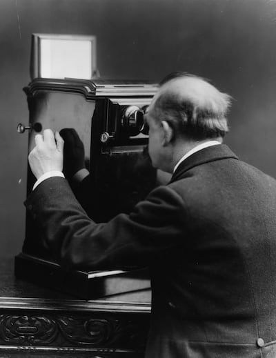 A man using a box stereoscope camera in the late 1800s. A similar camera was probably used to capture the oldest known photo of Sharjah. Getty Images