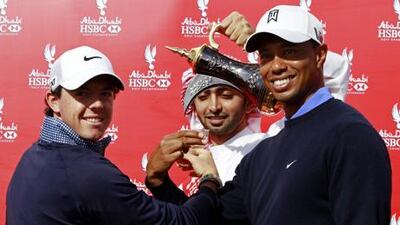 Roy McIlroy and Tiger Woods make a toast ahead of the Abu Dhabi HSBC Golf Championship.