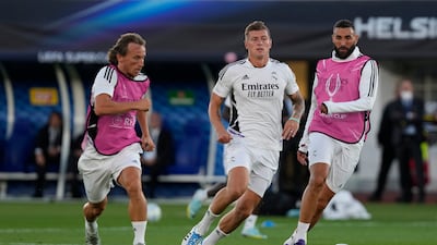 Real Madrid's Karim Benzema, right, Real Madrid's Luka Modric, left, and Real Madrid's Toni Kroos train during a training session at Helsinki's Olympic Stadium, Finland, Tuesday, Aug. 9, 2022. Real Madrid and Eintracht Frankfurt will meet in the UEFA Super Cup in Helsinki on Wednesday. (AP Photo / Antonio Calanni)