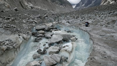 Melted glacier water streams over rock and gravel near Chamonix-Mont-Blanc, amid a record heatwave in France. Getty Images