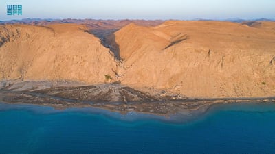Towering headlands are bathed in sunlight. SPA