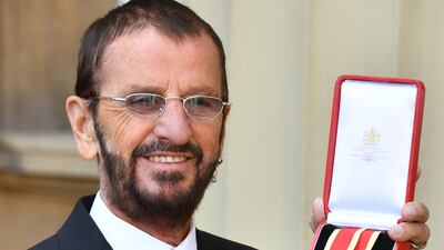Ringo Starr, real name Richard Starkey, poses at Buckingham Palace after receiving his Knighthood. John Stillwell WPA Pool / Getty Images