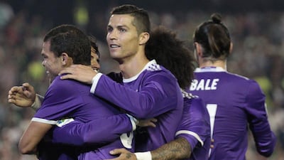 Real Madrid's Cristiano Ronaldo celebrates with teammates after scoring against Real Betis during their Primera Liga match at the Benito Villamarin Stadium, in Seville, Spain on Saturday, October 15, 2016. Angel Fernandez / AP Photo