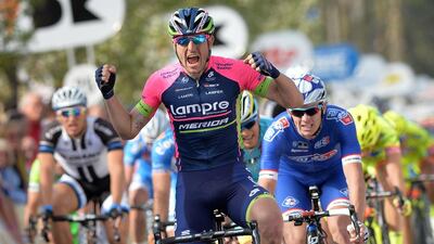 Italy's Sacha Modolo of team Lampre-Merida celebrates as he crosses the finish line to win the second stage of the "Three days of De Panne - Koksijde" cycling race, ran between Zottegem and Oostduinkerke, on Wednesday in Oostduinkerke. David Stockman / Belga / AFP / April 2, 2014