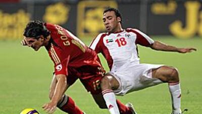 Germany's Mario Gomez, left, vies with UAE's Salem Masoud during their friendly in Dubai.