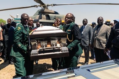 The coffin of former Zimbabwean president Robert Mugabe is carried to his final resting place. Jekesai Njikizana