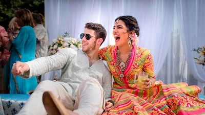 Priyanka Chopra and Nick Jonas celebrate during a mehendi ceremony, a day before their wedding, at Umaid Bhawan in Jodhpur, India. Photo: Raindrop Media via AP
