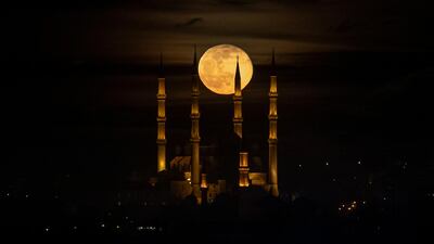 A full moon rises behind the Selimiye Mosque in Edirne, Turkey. EPA