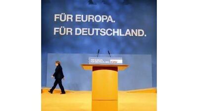Making an ordered departure: German Chancellor Angela Merkel leaves the stage at a conference in Leipzig after telling the audience that the eurozone sovereign debt situation has plunged Europe into its most difficult crisis since the end of the Second World War. Reuters