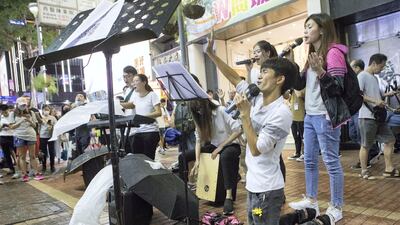 Singers perform a song in protest of police brutality and to try and promote peace and love during the violent times.