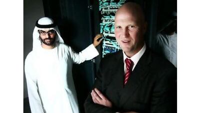 Badr Hubais, service development manager, left, and Steven Winstanley, acting chief operations officer, are just two of the people behind the Ankabut network project, which plans to provide better access and visibility for researchers across the country. Delores Johnson / The National