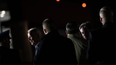 US Secretary of State Antony Blinken, right, follows Mr Biden, left, at the airport. AFP
