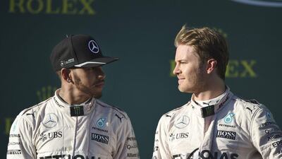 Mercedes driver Lewis Hamilton, left, looks at Nico Rosberg after finishing second to his Mercedes teammate at Sunday's Australian Grand Prix in Melbourne. Ross Land / AP / March 20, 2016