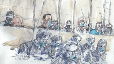 This court sketch made at the Paris courthouse shows the fourteen accused and their lawyers at the opening of the trial. AFP