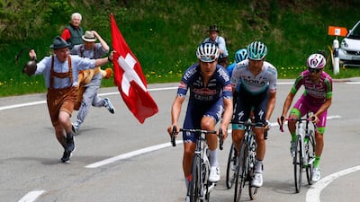 Spectators cheer breakaway riders Louis Vervaeke, Felix Grossschartner, Giovanni Visconti and and Vincenzo Albanese during Stage 20. AFP