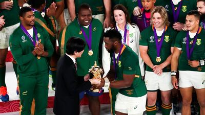 Japan's Crown Prince Akishino (front L) presents the Webb Ellis Cup to South Africa's flanker Siya Kolisi as they celebrate winning the Japan 2019 Rugby World Cup final match between England and South Africa at the International Stadium Yokohama in Yokohama. AFP