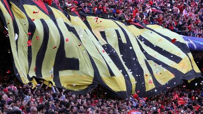 Atletico fans cheer their team. Cesar Manso / AFP