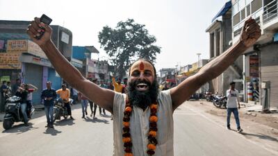 A sadhu, or a Hindu holy man, celebrates after the Indian Supreme Court's verdict on a disputed religious site in Ayodhya on November 9, 2019. Reuters