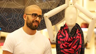 eL Seed never signs his name with his work. “I own the space while I am doing the wall but afterwards I leave it for the public. The focus is not on me, it is on the content of the message,” he said. Pawan Singh / The National