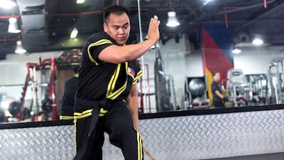 Guro demonstrates a weapon attack. Ruel Pableo for The National for Nick's story