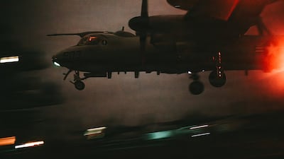 A US Navy E-2D Hawkeye command and control aircraft lands on the USS George Washington aircraft carrier in the Middle East. Centcom
