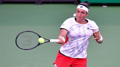 Ons Jabeur hits a forehand return to Anett Kontaveit. AFP