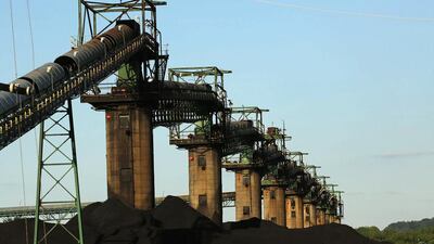 Coal is stacked at the base of coal loaders along the Ohio River in Ceredo, West Virginia. Robert Galbraith / Reuters